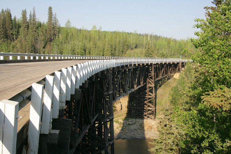 The Kiskatinaw Bridge is the longest wood curved bridge in North America and spans the Kiskatinaw River.