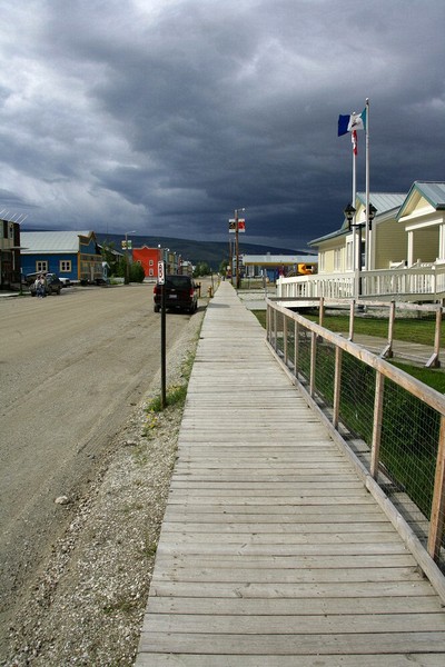 The whole town has dirt streets and what sidewalks they have are wooden.
